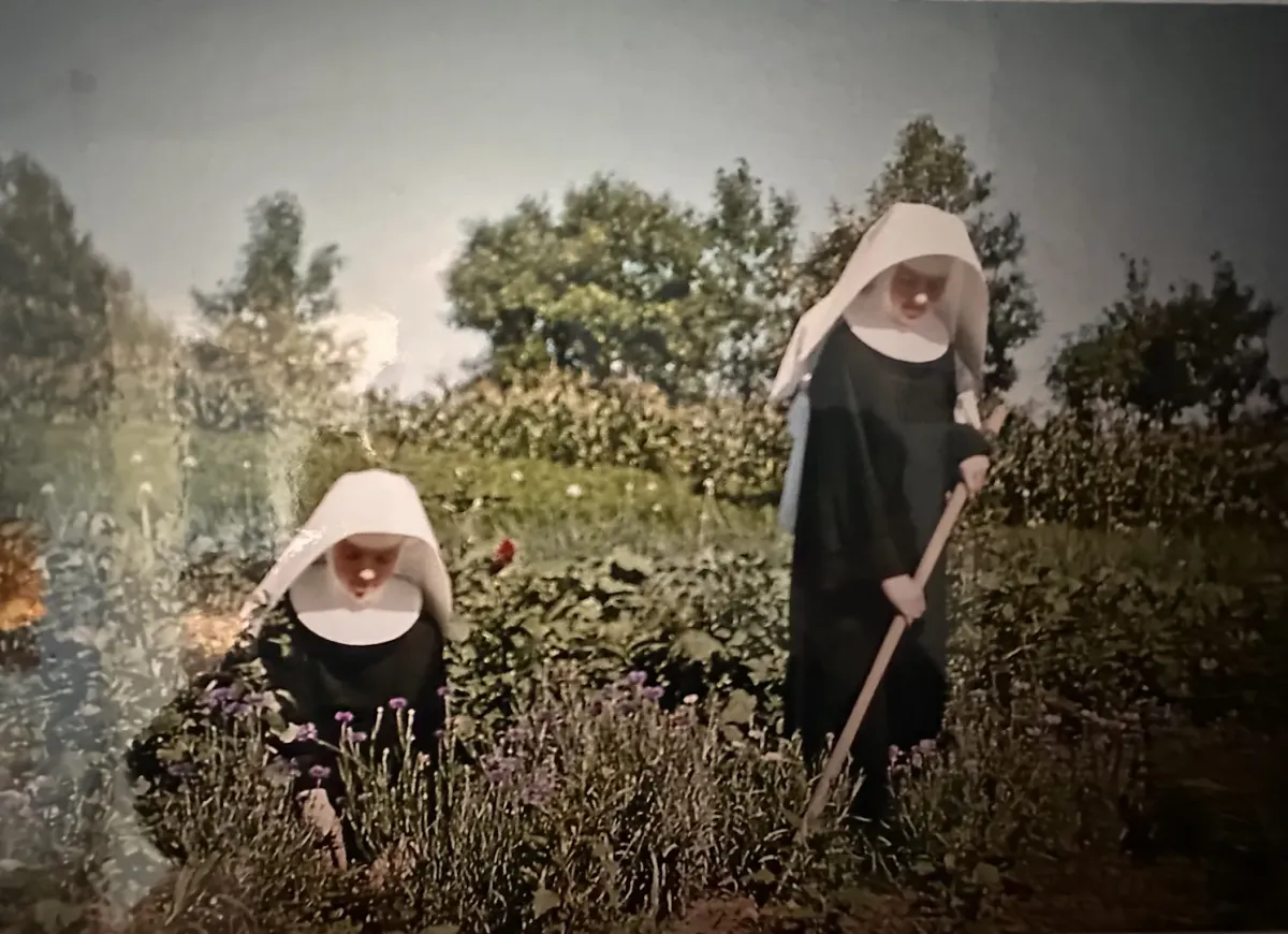 Two Sisters of St. Casimir tending a garden