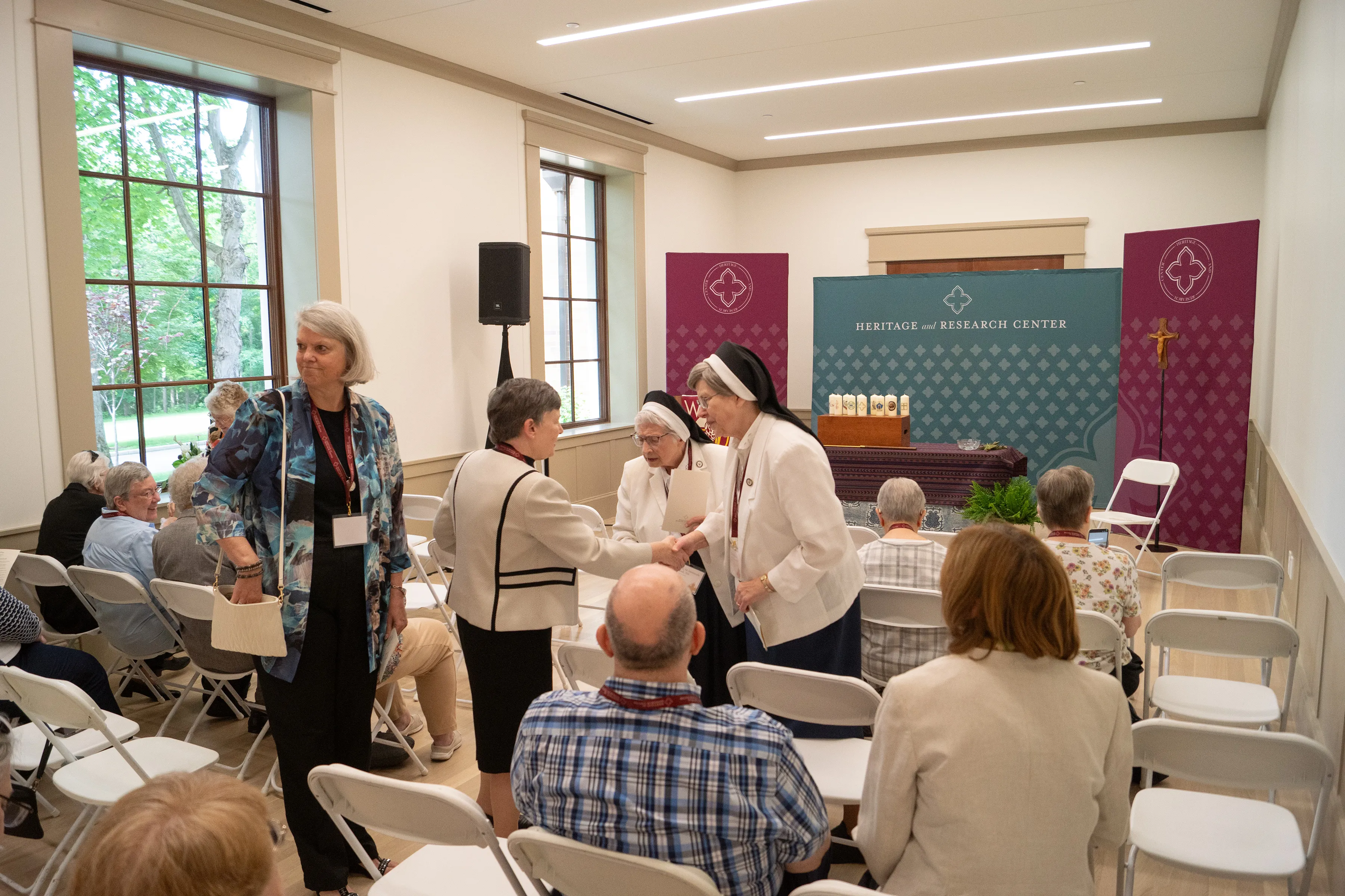 Sisters greeting attendees at a HARC event